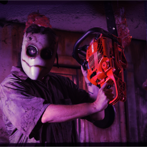Hayride Chainsaw actor at night at Scary Acres Rhode Island